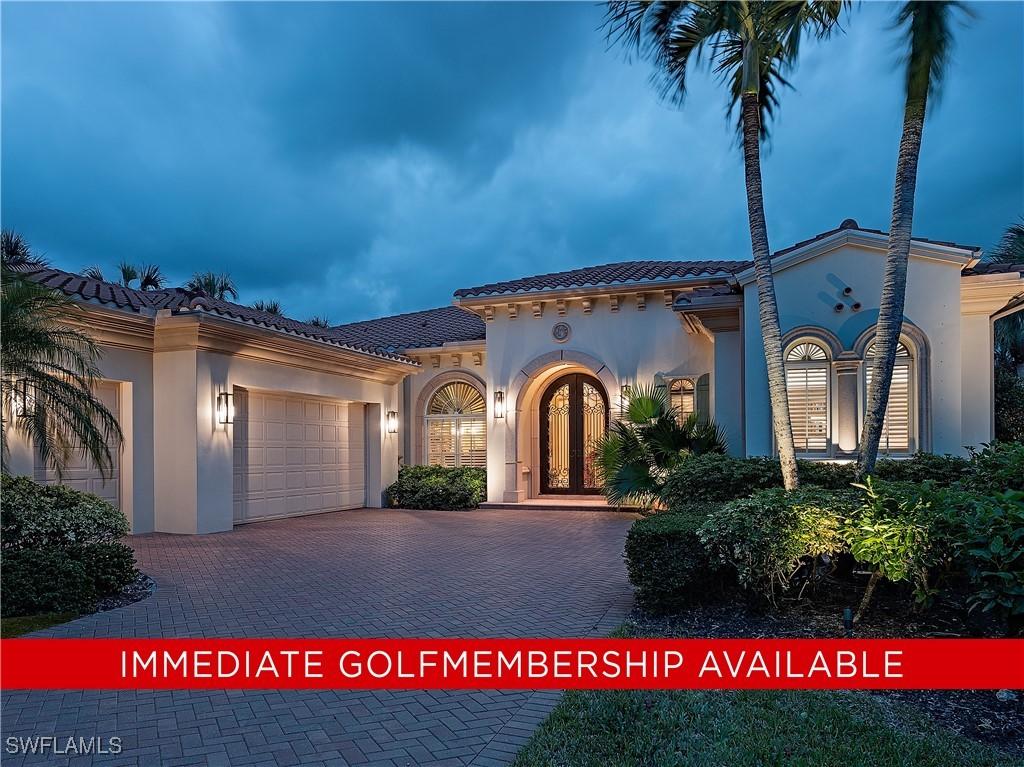 2012 Isla Vista Ln, Naples, FL 34105 - mediterranean / spanish house featuring stucco siding, decorative driveway, a tile roof, and a garage