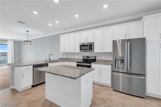 kitchen featuring stainless steel appliances, white cabinets, kitchen peninsula, and sink