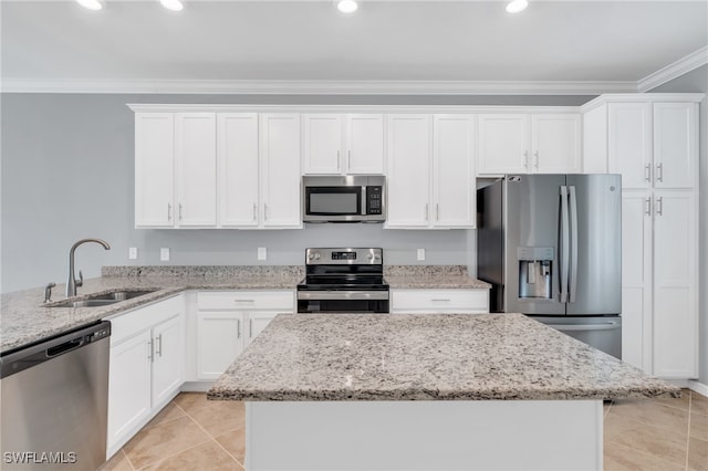 kitchen featuring light stone countertops, sink, stainless steel appliances, and white cabinets