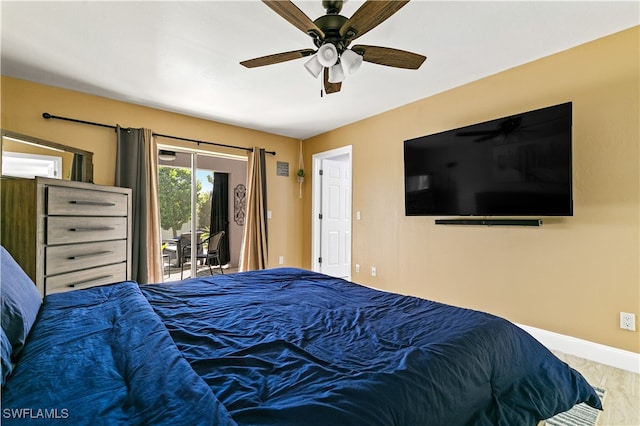 bedroom with access to exterior and ceiling fan