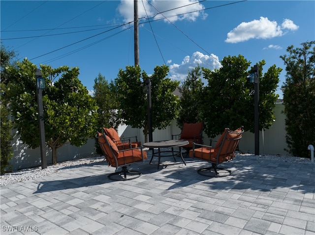 view of patio featuring a fire pit