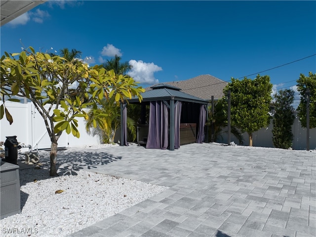 exterior space featuring a gazebo and a patio area