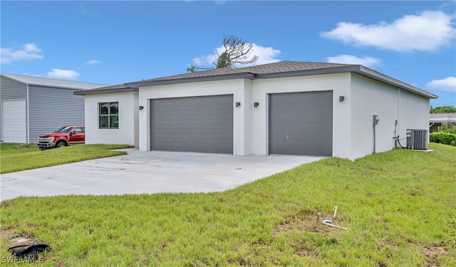 exterior space featuring a garage, cooling unit, and a lawn