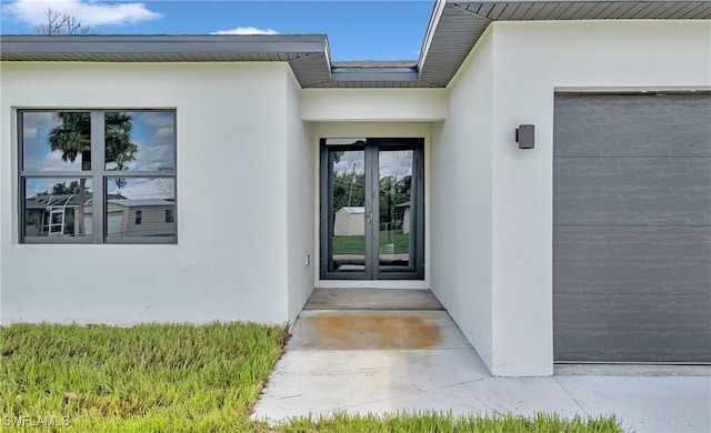 entrance to property featuring french doors