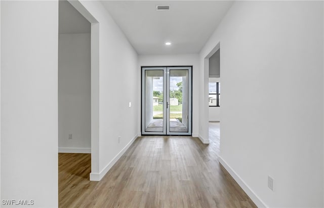 doorway with light hardwood / wood-style floors