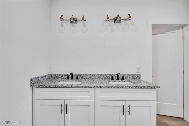 bathroom featuring tile patterned floors and vanity