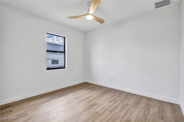 unfurnished room with ceiling fan and light wood-type flooring