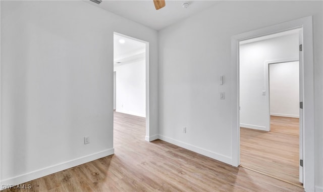 empty room featuring ceiling fan and light hardwood / wood-style floors