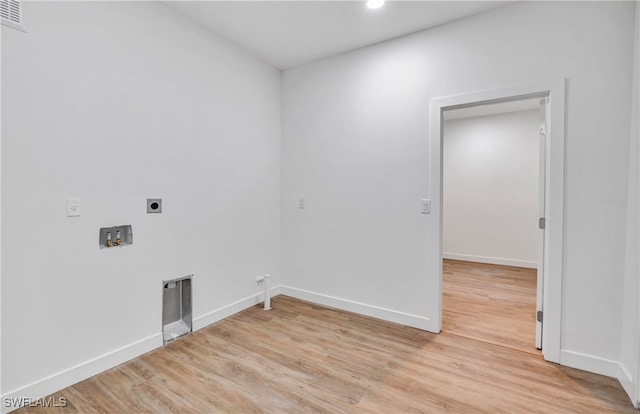 laundry room featuring washer hookup, light hardwood / wood-style flooring, gas dryer hookup, and electric dryer hookup