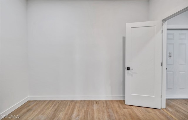 spare room featuring light hardwood / wood-style flooring