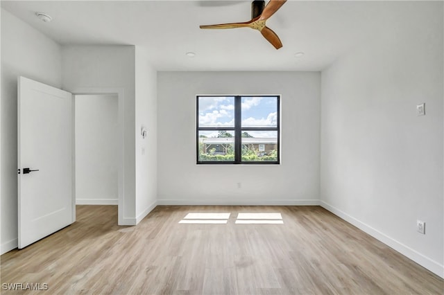 unfurnished bedroom with ceiling fan and light wood-type flooring