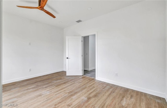 spare room with ceiling fan and light hardwood / wood-style flooring