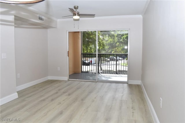 empty room featuring crown molding, ceiling fan, and light hardwood / wood-style floors