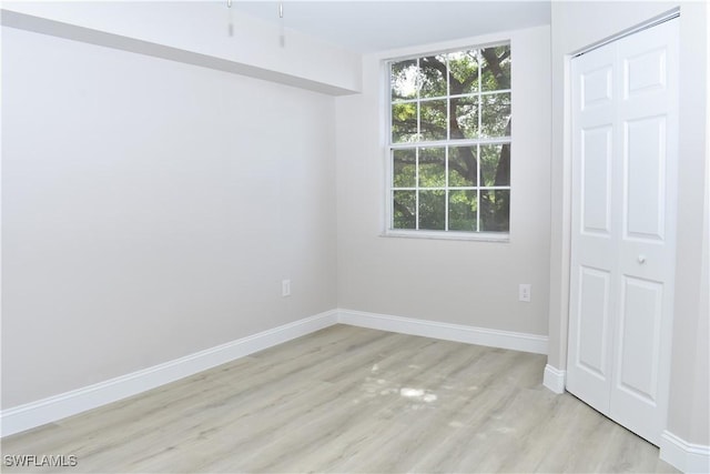 unfurnished bedroom featuring light wood-type flooring