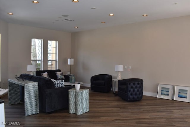 living room with dark hardwood / wood-style floors