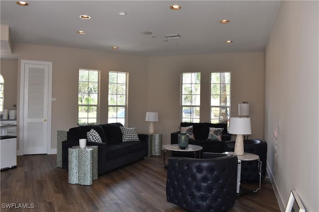 living room with dark hardwood / wood-style floors