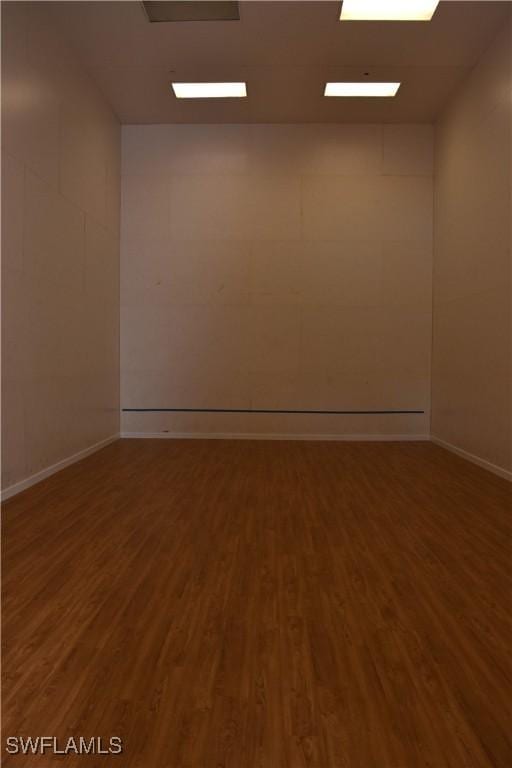 empty room featuring dark hardwood / wood-style flooring