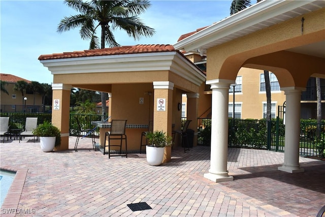 view of patio featuring exterior bar