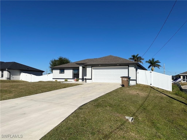 view of front of house featuring a garage and a front lawn