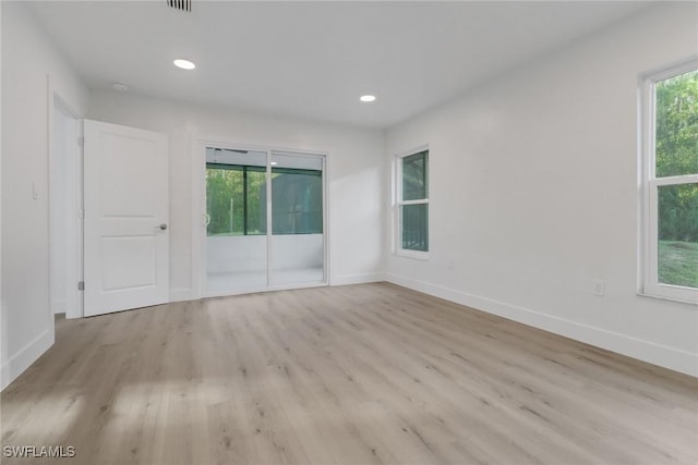 unfurnished room with light hardwood / wood-style flooring