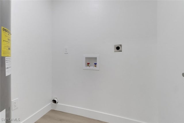 laundry area featuring hookup for an electric dryer, light hardwood / wood-style floors, and hookup for a washing machine