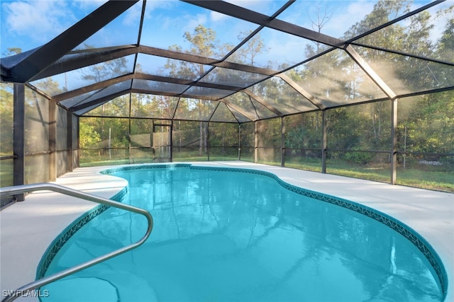 view of swimming pool with a lanai