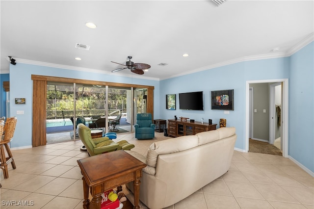 tiled living room featuring crown molding and ceiling fan