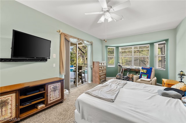 carpeted bedroom with ceiling fan and access to exterior