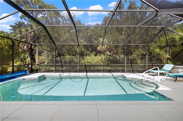 view of pool featuring a lanai and a patio area