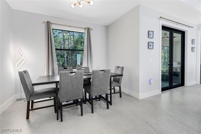 dining area featuring an inviting chandelier