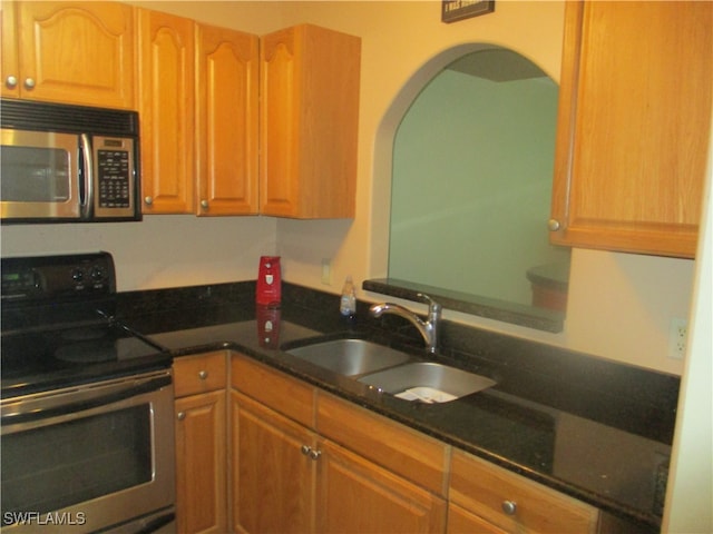 kitchen featuring appliances with stainless steel finishes and sink