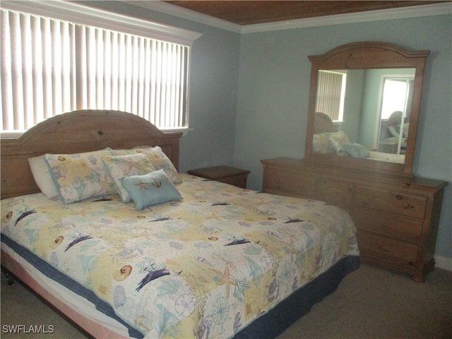 carpeted bedroom featuring crown molding