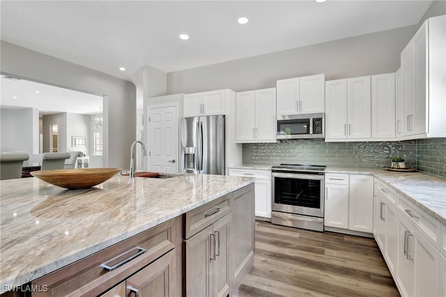 kitchen featuring appliances with stainless steel finishes and white cabinetry