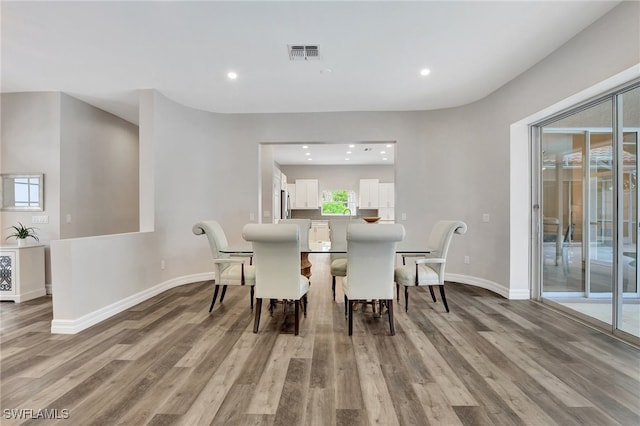 dining space featuring light hardwood / wood-style floors