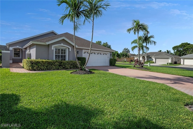 ranch-style home featuring a front lawn and a garage