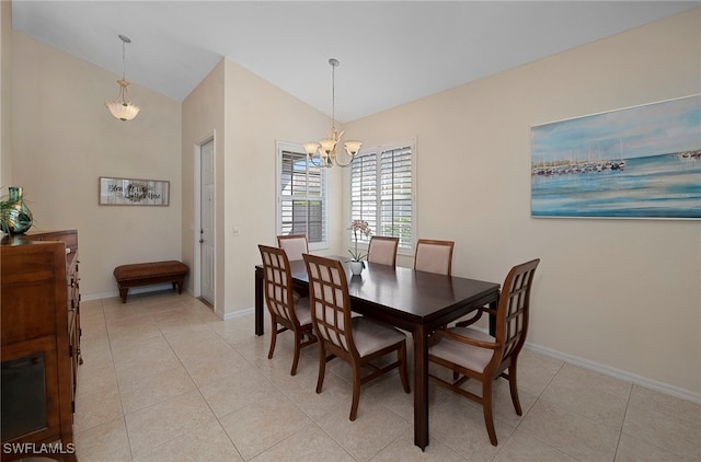 dining room featuring a notable chandelier, lofted ceiling, and light tile patterned flooring