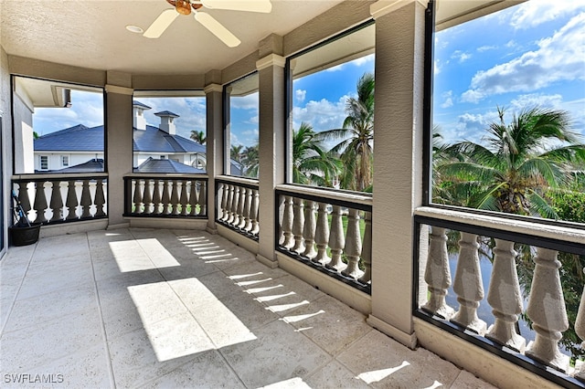 sunroom / solarium featuring ceiling fan