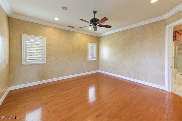 spare room featuring ceiling fan, wood-type flooring, and ornamental molding