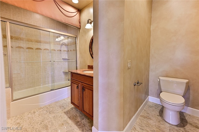 full bathroom with shower / bath combination with glass door, vanity, and toilet