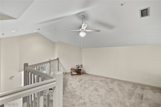 bonus room with ceiling fan, light colored carpet, and vaulted ceiling