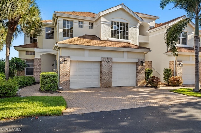 view of front of home with a garage and central AC unit