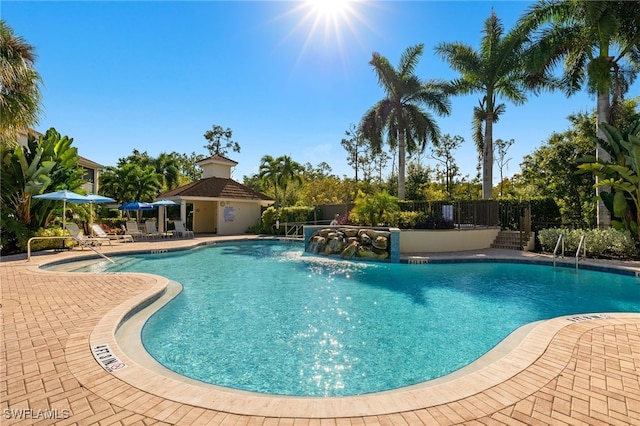 view of pool featuring a patio and pool water feature