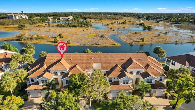 drone / aerial view with a water view