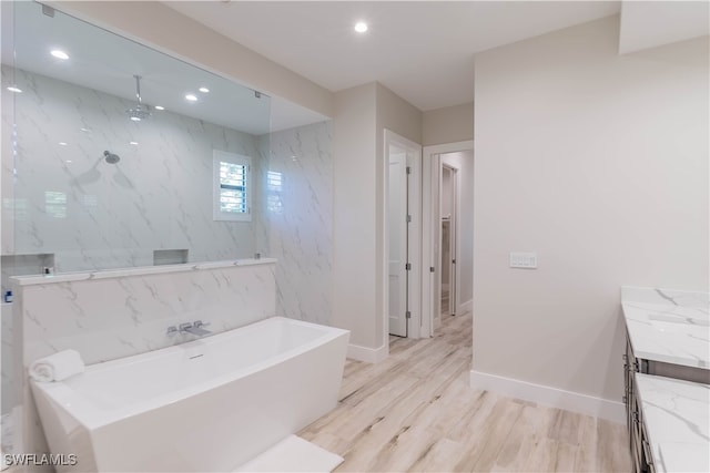 bathroom featuring vanity, separate shower and tub, and hardwood / wood-style flooring