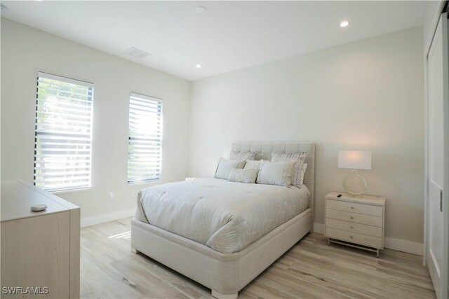 bedroom with light hardwood / wood-style floors