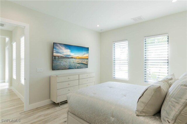 bedroom with light hardwood / wood-style floors