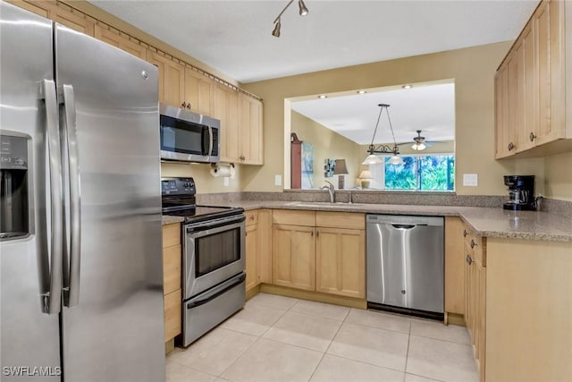 kitchen featuring sink, ceiling fan, light tile patterned floors, light brown cabinetry, and stainless steel appliances