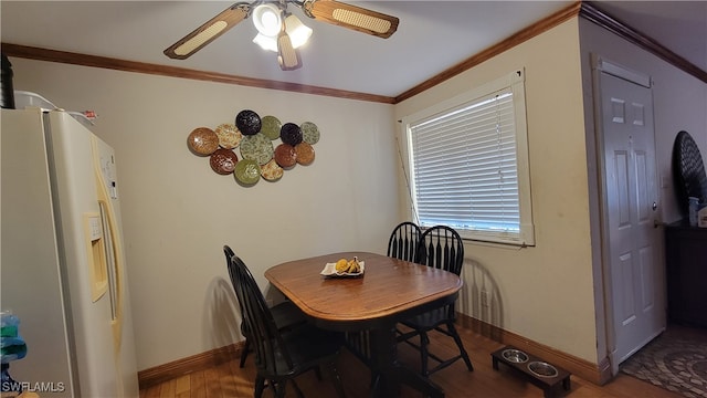 dining space featuring crown molding, ceiling fan, and hardwood / wood-style floors