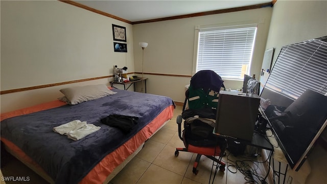 bedroom with crown molding and light tile patterned floors