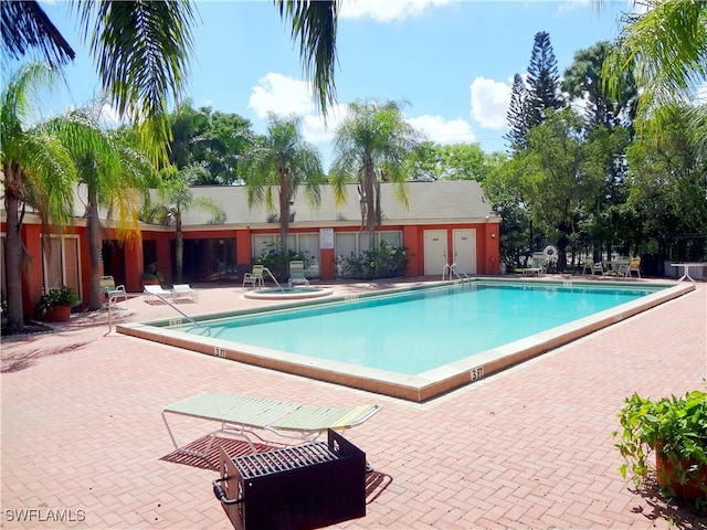 view of swimming pool featuring a patio area